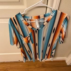 A short sleeve pocket tee in Turquoise and orange. Size small, super comfy
